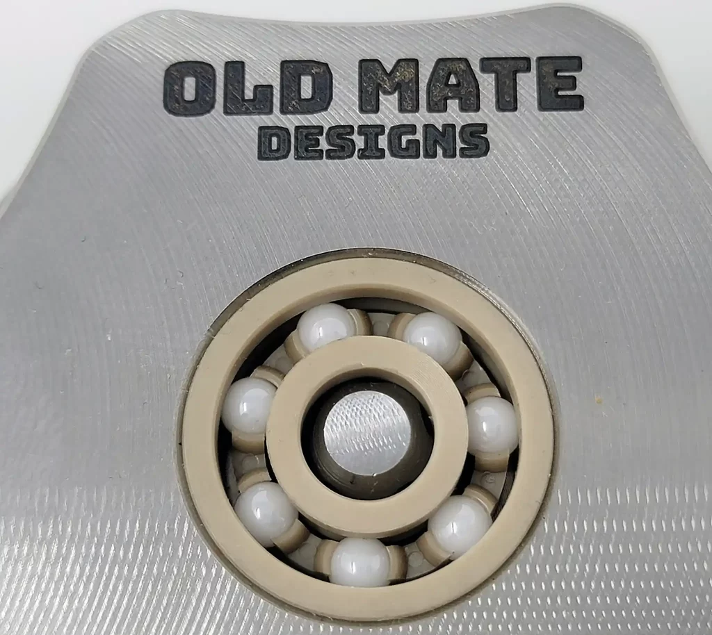 The Old Mate is a stainless steel grinder with a functional ball bearing spinning top