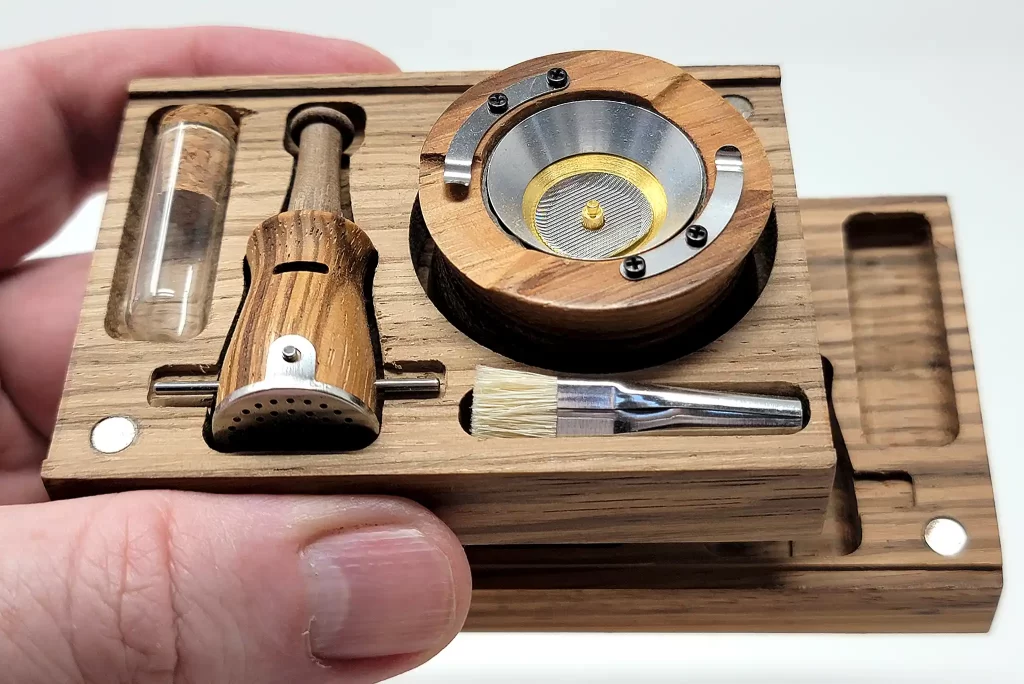 The wooden Vapman case is about the size of a deck of cards