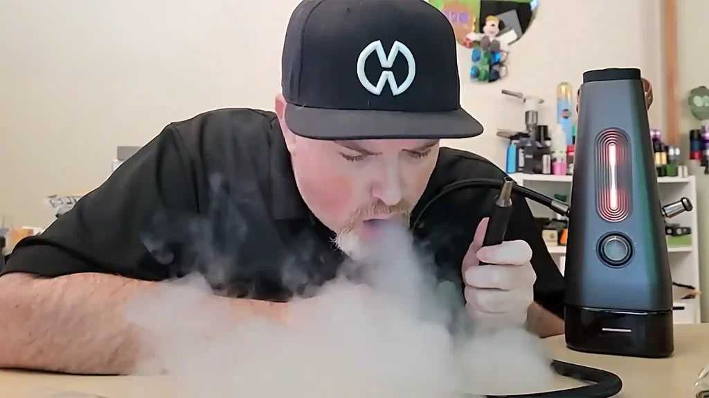 Troy blowing thick vapor using the Airvape Enso portable hookah. Screenshot from the Enso Review Video