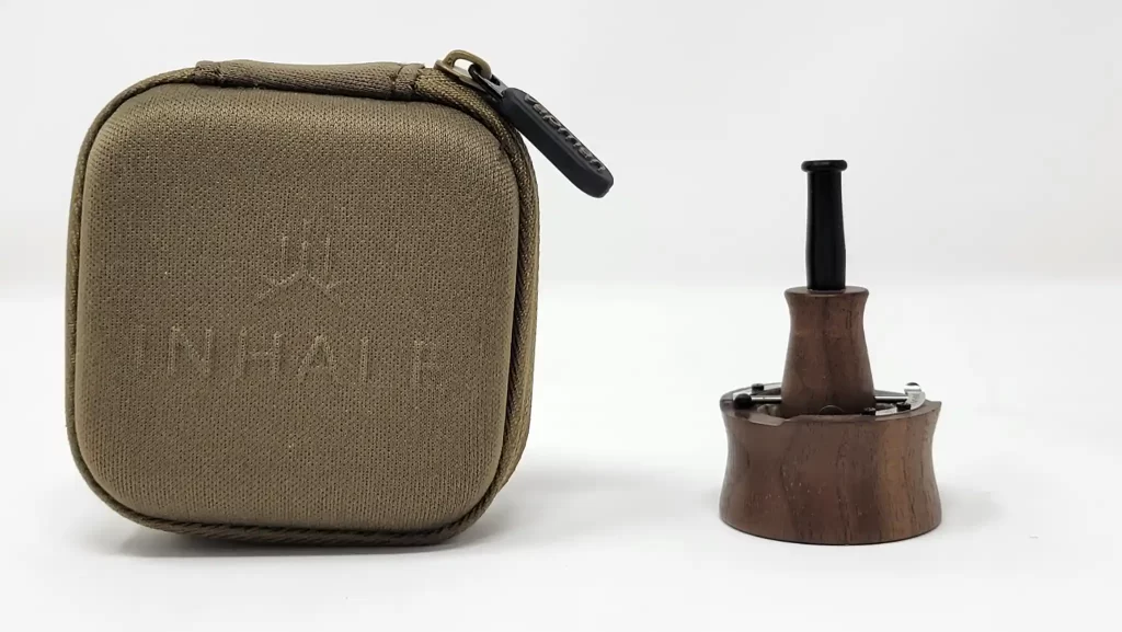 Vapman Click in Walnut next to its carrying case