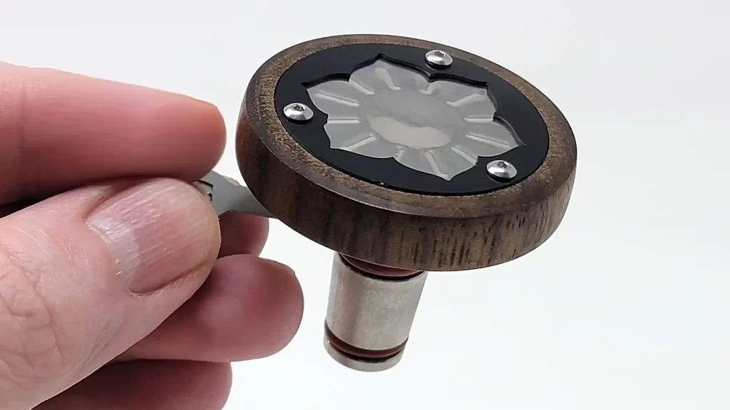 The Lotus Vaporizer Cap and bowl are small, as demonstrated with the 3 finger grip