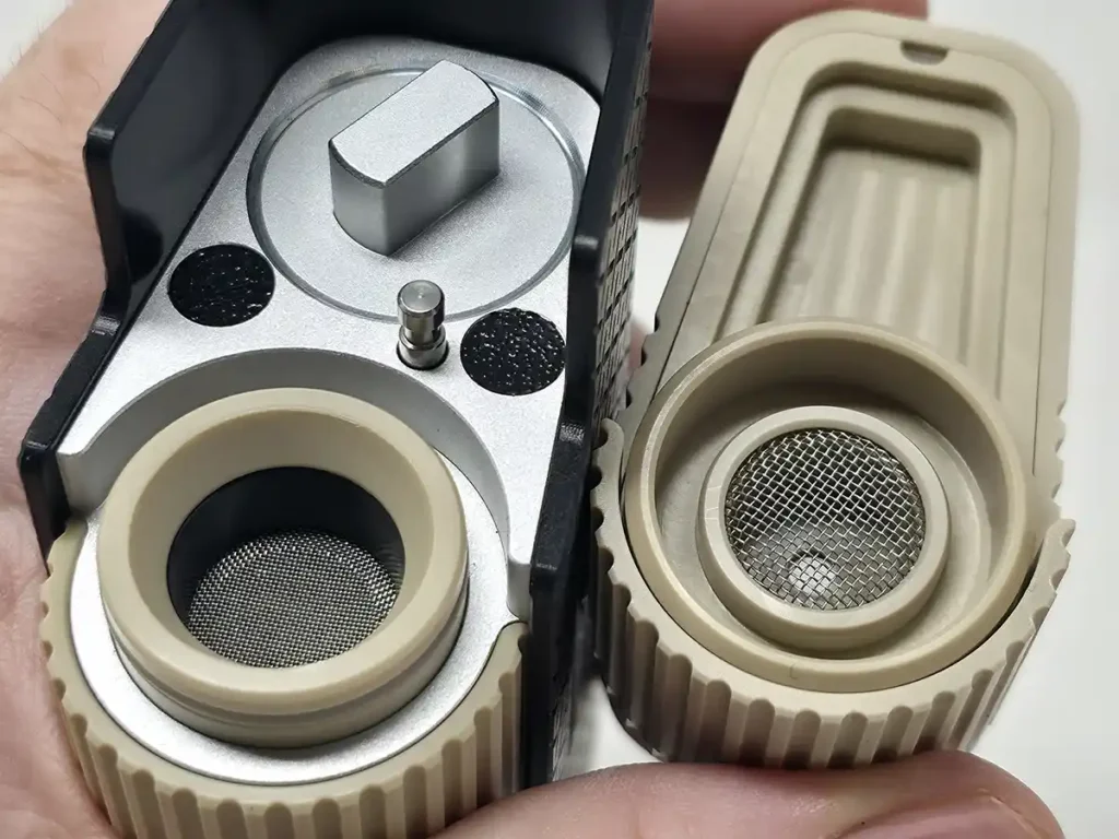 Frolic vaporizer with its bowl open and exposed