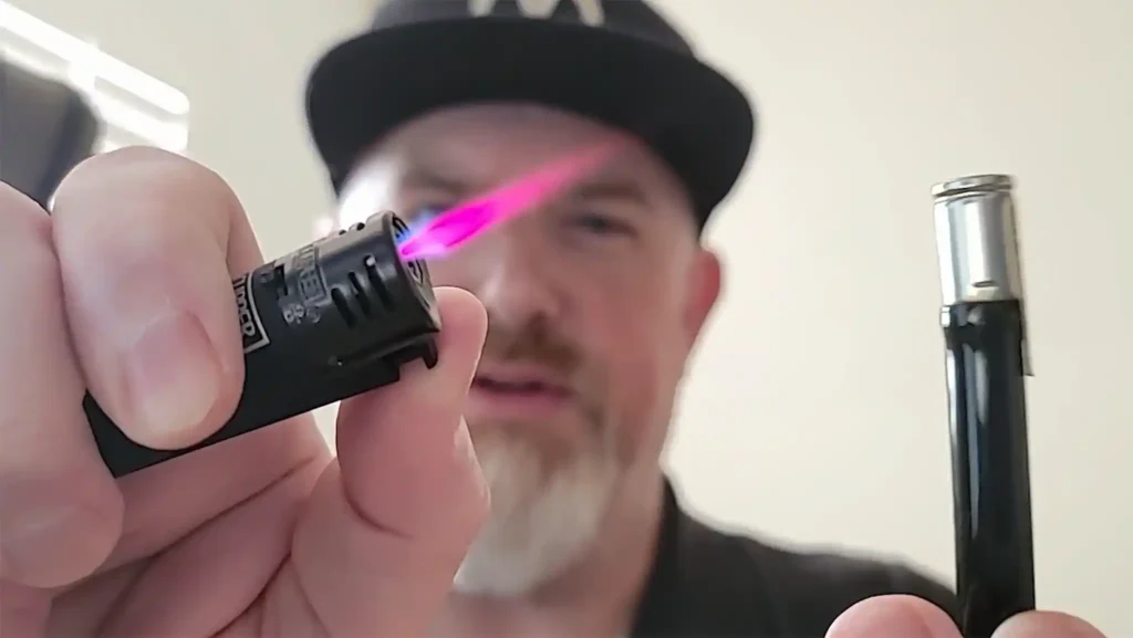 The Budget Friendly Dynavap G3 is an all glass vaporizer with a stainless steel cap and a pink jet lighter