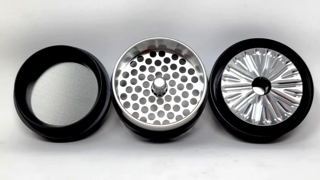 The Flower Mill 2.5 Premium grinder pulls apart to three main pieces