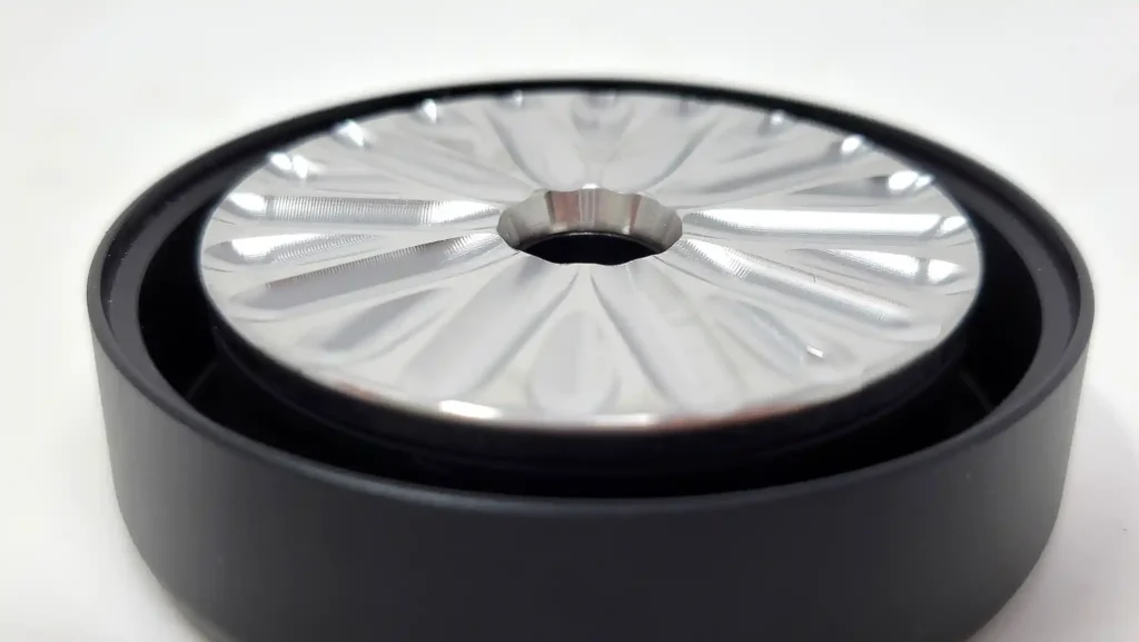 Flower Mill has a grooved stainless steel milling surface on its top half instead of teeth