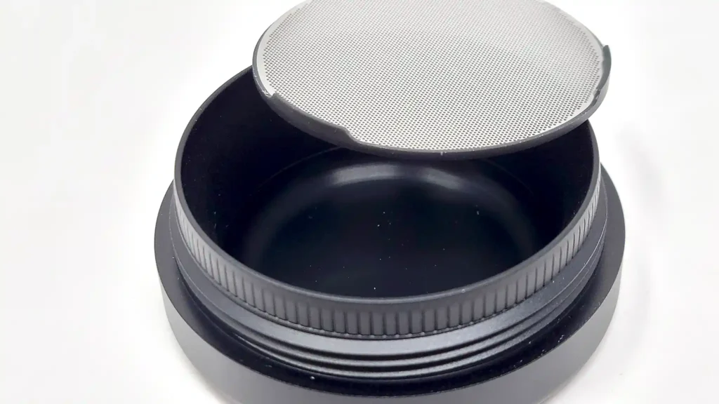 The Flower Mill grinder's bottom section with the kief screen removed