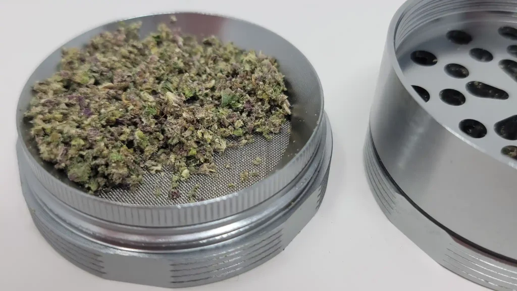 The 2.5" HR SHRED grinder has removable kief screen and an angled weed storage area