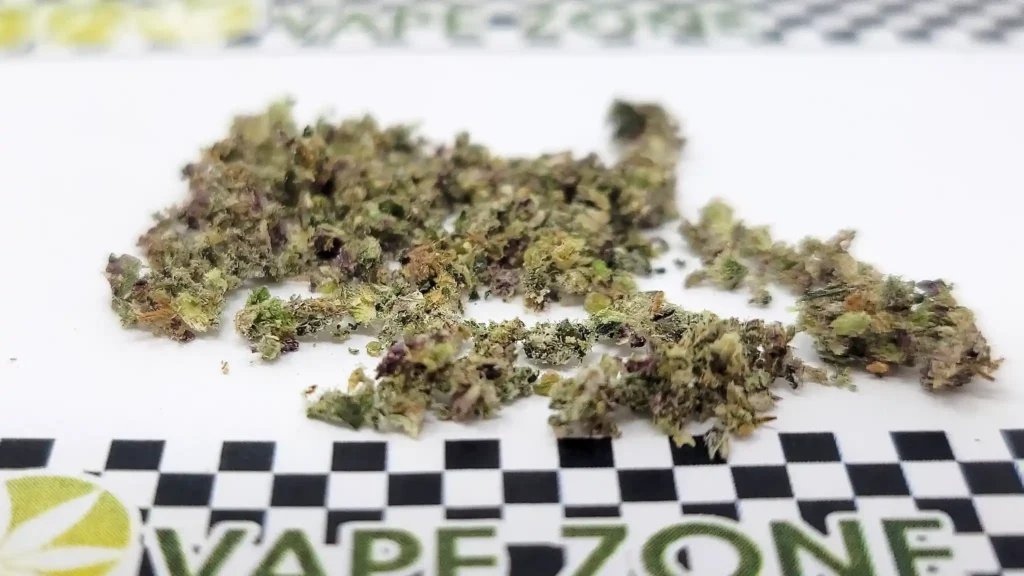 Close-up picture of the ground cannabis from the 2.5" SHRED shows a medium-coarse grind consistency
