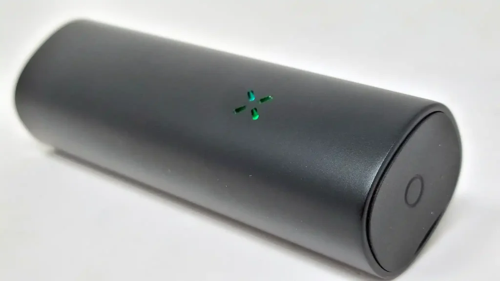 Pax Flow has the flower petal LED lights on one side and the familiar flat mouthpiece on its end