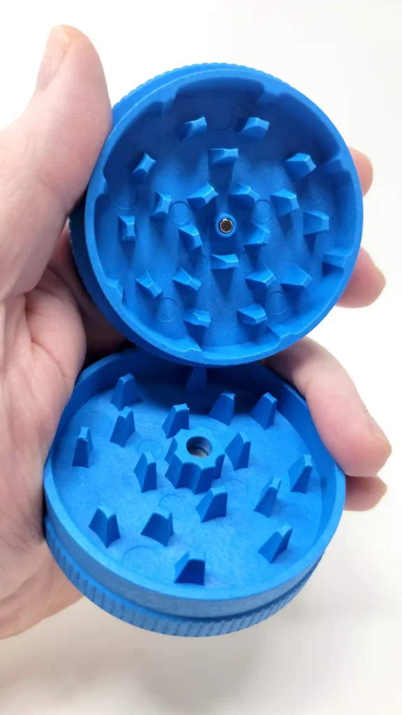 Santa Cruz 2 Piece Hemp Grinder teeth exposed with both pieces held in one hand