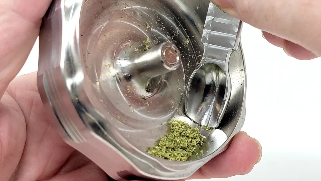 Old Mate weed scoop fits the stainless steel grinder perfectly