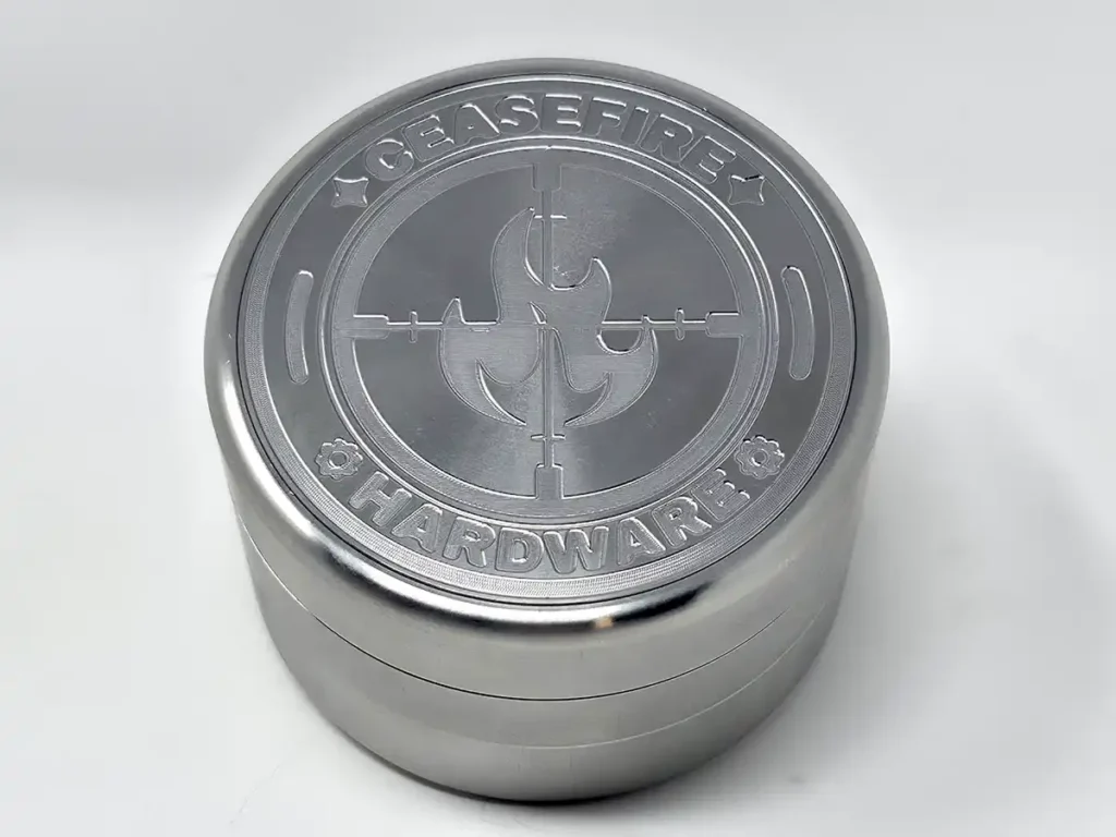 stainless steel spinny grinder from dabhut has a CeaseFire Hardware logo