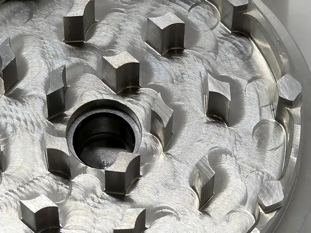 Closeup view of Cyber Grinder top teeth and bearing
