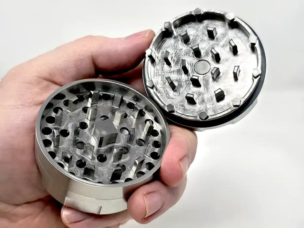 Draken 2 weed grinder has trapezoid shaped teeth and a threadless design