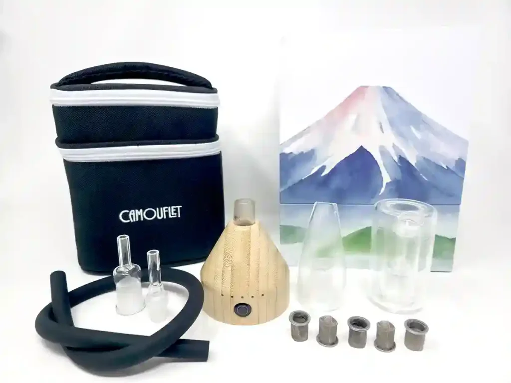Camouflet Fuji vaporizer comes with a travel case, whip, glass whip connections, two glass mouthpiece toppers, and 5 stainless steel screen capsules
